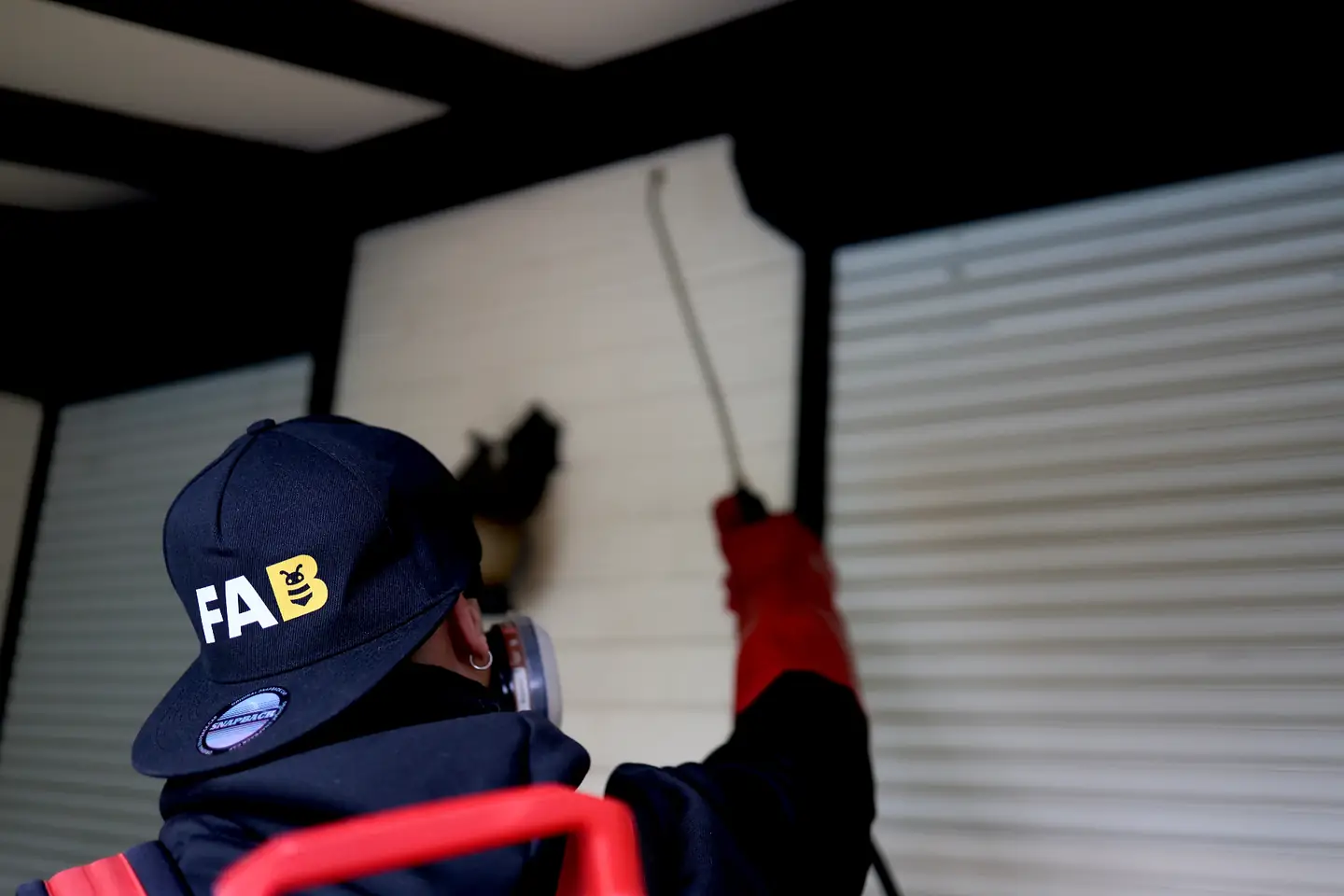 FAB Pest Control technician speaking with a property manager outside a rental property